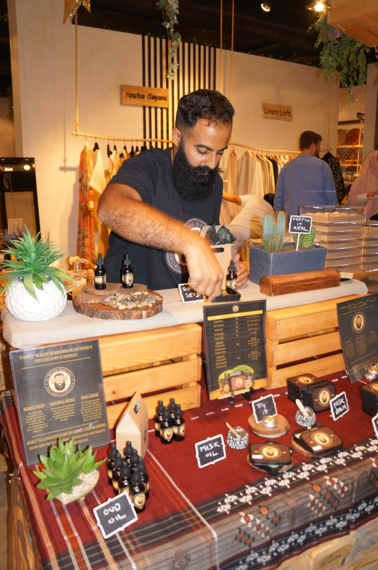 Waseem Sendi arranging an early Diggn’It market display in Jeddah.