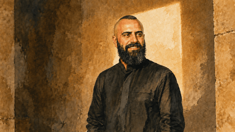 Watercolor portrait of Waseem Sendi, with closely shaved sides, a narrow strip of hair combed flat across the crown and a full beard, standing against warm stone between shadow and a rectangular shaft of light.
